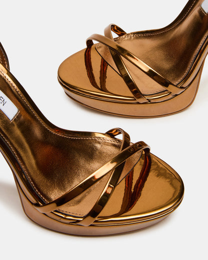 JUNI Bronze Criss Cross Stiletto Ankle Strap Women's Heel